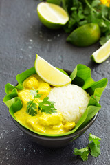 Yellow curry with chicken and rice. Asian cuisine.