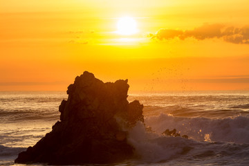 Sunset reflection in the ocean on Arrietara beach, Atxabiribil Sopelana, Basque Country (Euskadi), Spain