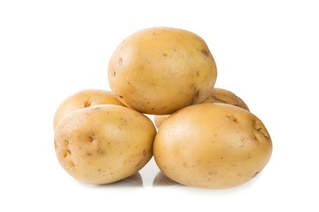 Heap of fresh young potatoes isolated on white background close up.