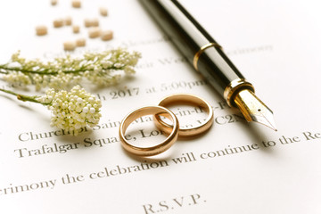 Wedding invitation with gold rings