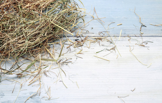 Hay on wooden background