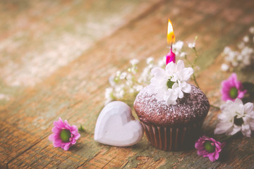 Obraz na płótnie Canvas Birthday Cake with Candle, Flowers and Heart