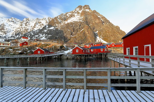 Red cottages-rorbuer in A i Lofoten. Tinddalstinden-Stottlikollen-Tindstinden mounts background. Sorvagen-Moskenesoya-Nordland-Norway.0326