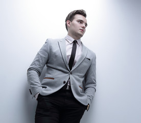 closeup of a young man in a business suit.