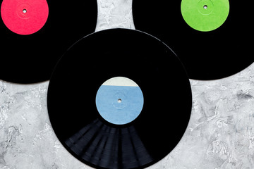 records in music studio for dj or musician work on stone background top view