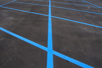 Freshly paved in painted parking lot.