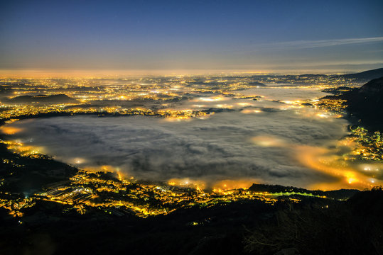 A heart of fog over Oggiono and lake Pusiano, Barro Mount, Oggiono, Lecco province, Lombardy, Italy.