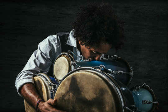 Musician kissing his bata drums