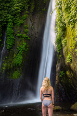Girl in front of an waterfall