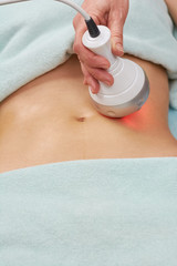 Rf skin tightening, female belly. Body of woman, cosmetology procedure. Body contouring and cellulite reduction.