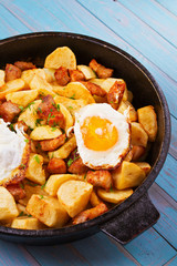 Pan-fried potato, eggs and meat