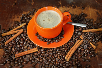 Coffee still life with an orange mug
