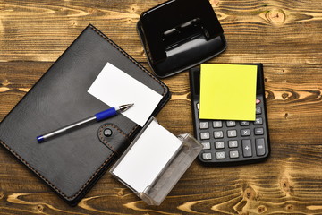 Leather covered notebook and stationery, top view