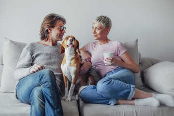 Mature couple enjoying early morning with their dog