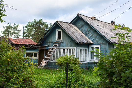 A typical residential wooden house in settlement in Leningrad region, Russia.
