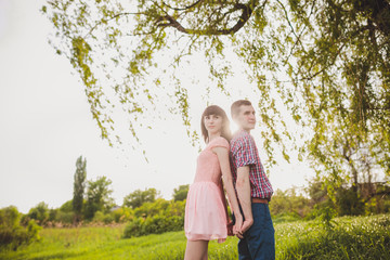 young couple in love together on nature