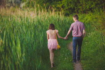 young couple in love together on nature in summer