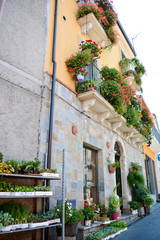 Fototapeta na wymiar italian flowered balconies
