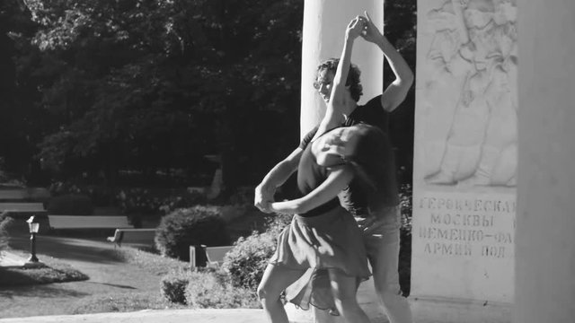 Young couple dancing in the park