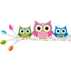 Owls family sitting on a branch