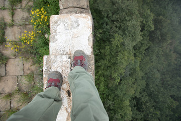 successful hiker legs on the top of great wall