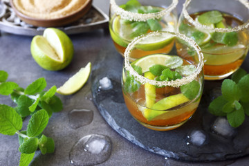 Three glasses of cold refreshing summer lemonade mojito