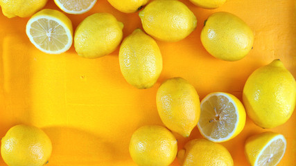 Lemons on yellow wood table