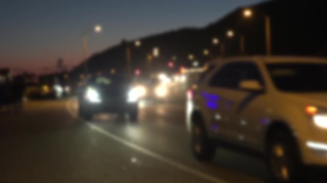 Traffic on the Pacific Coast Highway at Malibu fading out of focus, with sound
