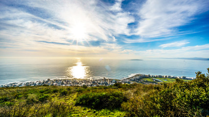 Sun setting over the Atlantic Ocean, Sea Point and Camps Bay. Viewed from Signal Hill at Cape Town, South Africa