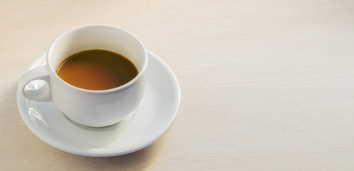 cup of coffee on table in coffee shop cafe with copy space.