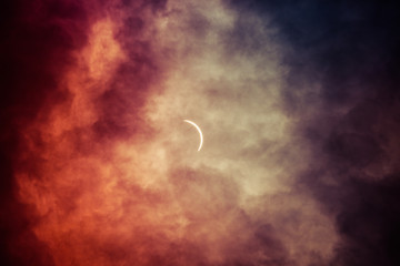 solar eclipse with clouds