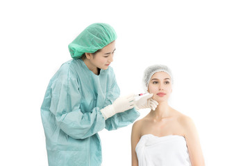 Beautiful young woman receiving Botox injection isolated on white background. Beauty concept.