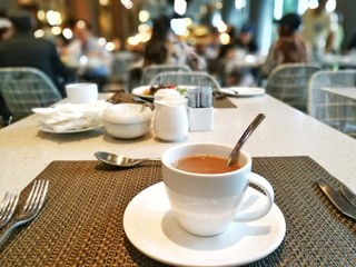 a hot milk coffee cup of coffee in a restaurant