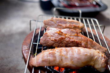 Roast pork on charcoal stove