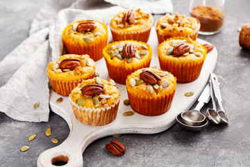 Homemade pumpkin muffins with pecans. Food background