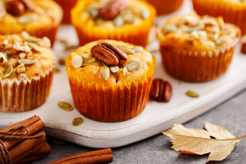 Homemade pumpkin muffins with pumpkin seeds and pecans.