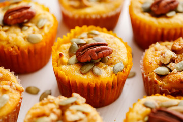 Homemade muffins of pumpkin with pecans. Close up