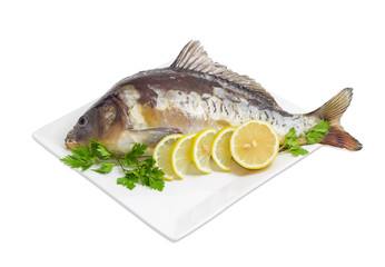 Mirror carp prepared for cooking on dish