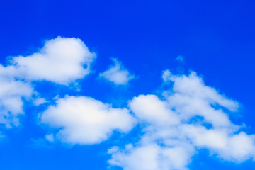 Bright blue sky with white clouds