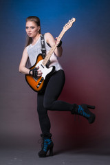 Girl with guitar at the rehearsal before the performance