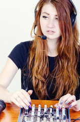 Girl behind the music console © skilas