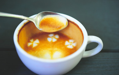 hot coffee with foam milk art of love. White cup of coffee. Coffee cup