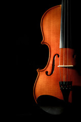 Closeup Violin orchestra musical instruments on black background