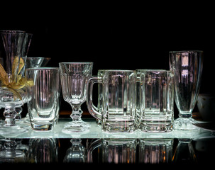 various glasses on black background