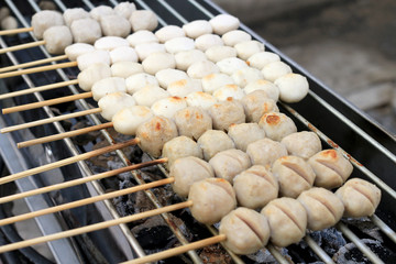 Grilled meatballs on the stove. Thai Street Food .