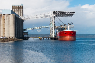 Bulk grain carrier ship at grain terminal, Tacoma, Washington