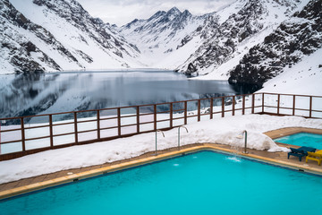 Snow Mountains, Resort Lake. Peak View, Rocks. Beautiful Background Cliff. Mountain Landscape Wallpaper. Isolated Snow Background. Outdoor Swimming pool. Winter Snow Spa Background Wallpaper. Panorama