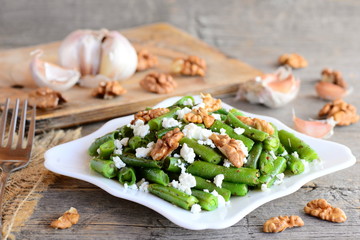 Warm green bean salad with cottage cheese and peeled walnuts. Diet green beans recipe. Vegetarian...