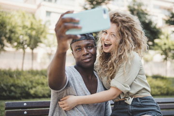 mixed race couple doing a selfie