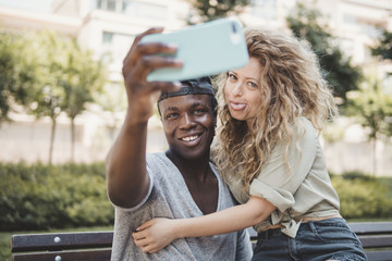 mixed race couple doing a selfie